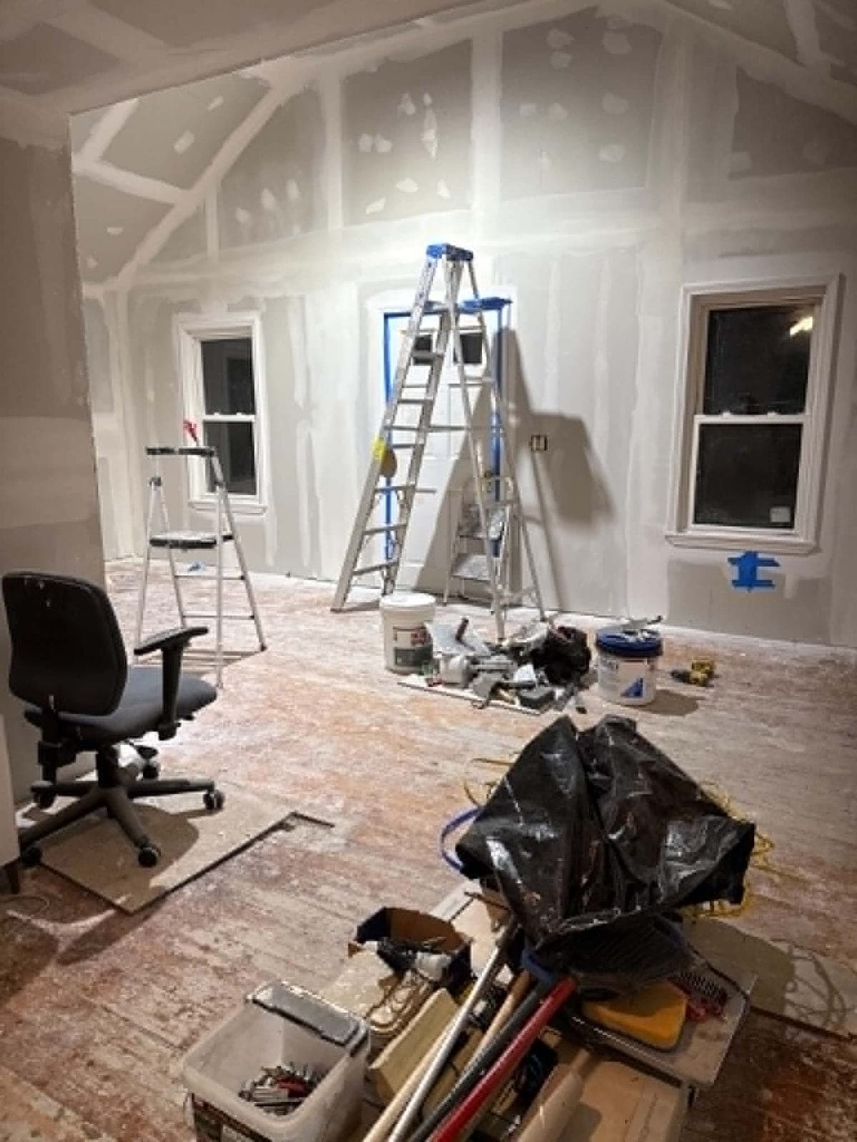 Drywall repair in progress on a damaged wall
