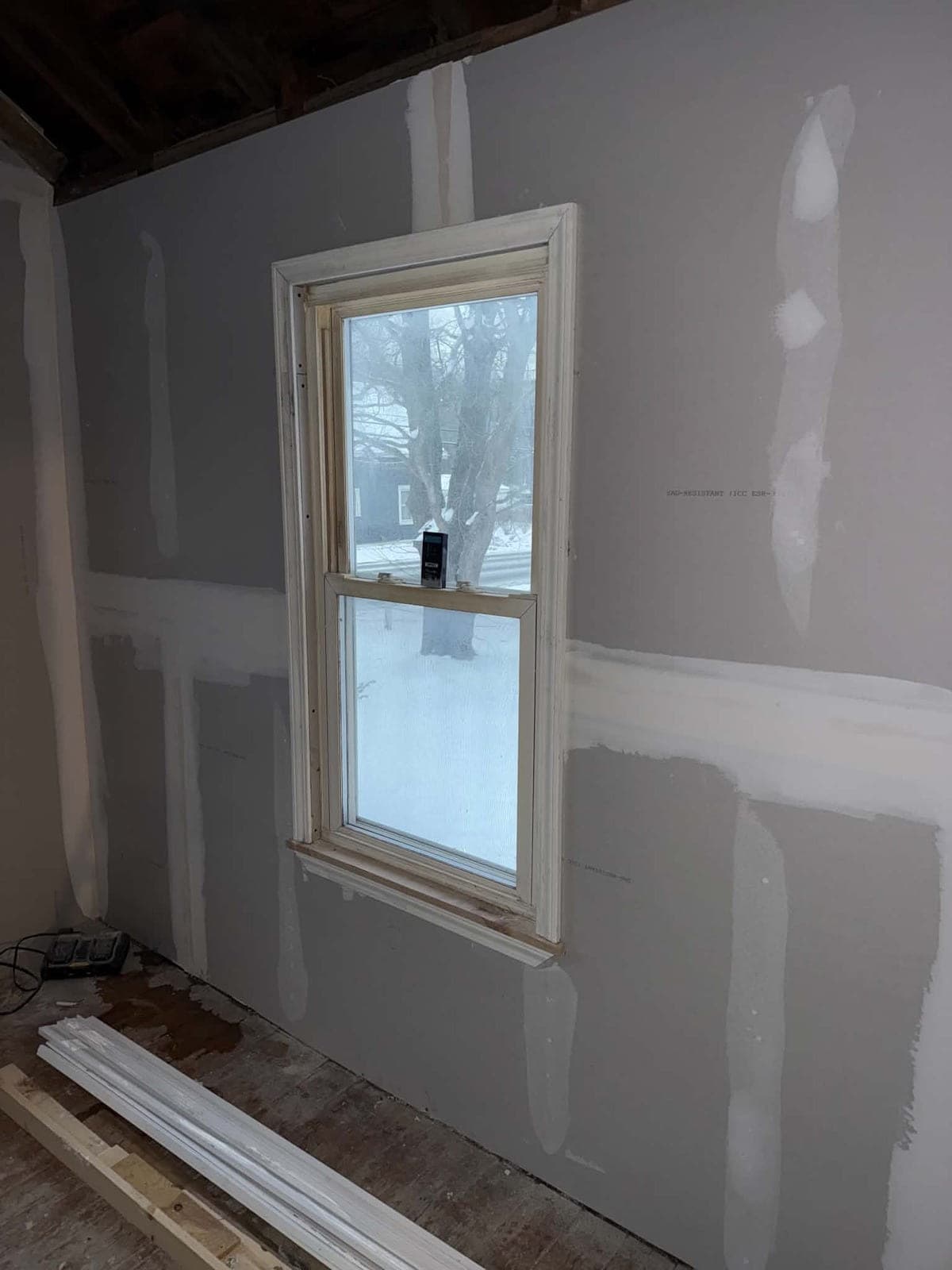 Finished drywall seam and corner detail at a window