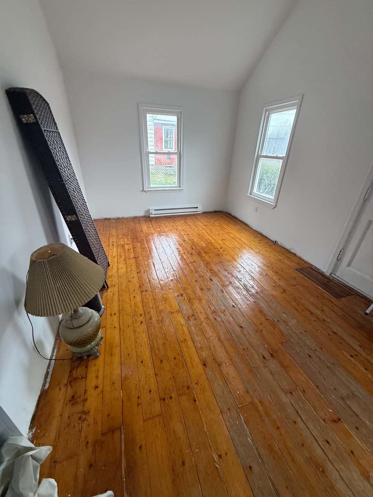 Finished interior room with hardwood floors