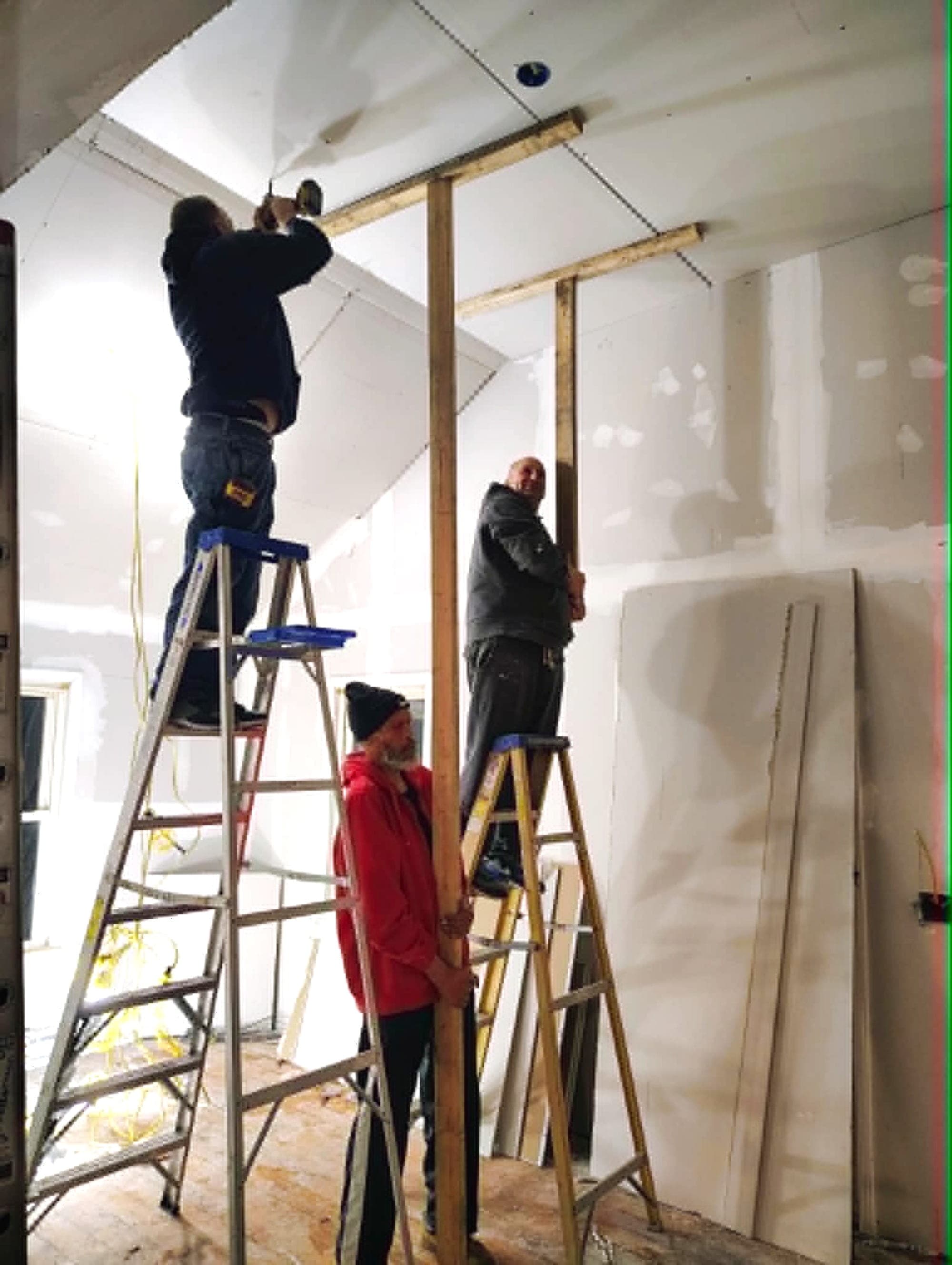 Poppa Mark crew hanging and finishing drywall, taking a room from stud to finish